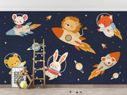 Wallpaper with space-themed design featuring animals on rockets and planets.