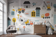 Children's room with construction-themed wall mural, furniture, and toys.