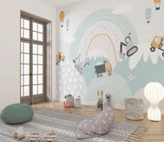 Children's room with colorful wall mural, toys, and soft furniture.