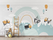 Children's room with a colorful wall mural featuring a rainbow, mountains, and construction vehicles.