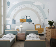 Children's bedroom with a truck-themed mural on the wall.