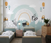 Children's bedroom with a mural of construction vehicles and a rainbow.