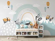 Children's room with a rainbow and cloud mural, toys, and a bench.