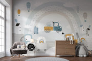 Children's room with a colorful wall mural featuring vehicles and houses.
