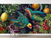 Wall mural with parrots and fruits on a wall with a chair in front