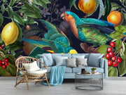 Living room with a large wall mural of parrots and fruits, featuring a sofa, chair, and coffee table.