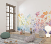 Room interior with floral wall mural, rug, pouf, and decorative items.