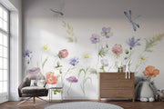 Room interior with floral wall mural, furniture, and decor items.