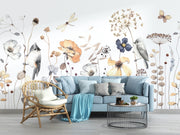 Living room with a blue sofa, wicker chair, and decorative wall mural featuring flowers and birds.