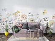Living room with a purple sofa, decorative pillows, and floral wall art.