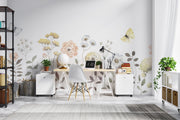 Modern office space with floral wallpaper, desk, chair, and decorative items.