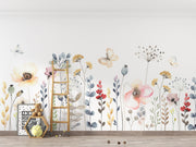 Wall with floral wallpaper, ladder, and toys on a wooden floor.