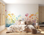 Bedroom with colorful floral wall mural and wooden flooring