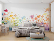Colorful floral mural on a wall in a bedroom with a bed and desk.