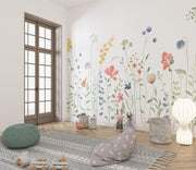 Room interior with floral wall decals, a rug, and decorative items.