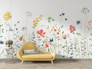 Yellow sofa in front of a wall with colorful floral decals