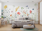 Bedroom with floral wall decals and a bed with polka dot bedding.