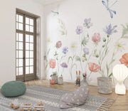 Room interior with floral wallpaper, rug, and decorative items.