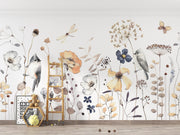 Wallpaper with floral and bird designs on a wall with a ladder and toys below.