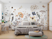 Bedroom with floral and bird wall decals on a white wall.