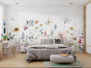 Modern bedroom with floral wall art and a neatly made bed.