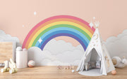 Children's room with a teepee, rainbow wall mural, and toys on a wooden floor.