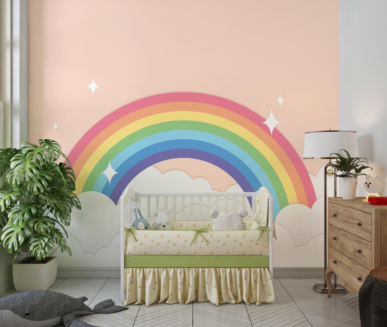 Children's room with a rainbow mural on the wall, crib, and dresser.