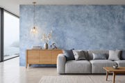 Soft Blue Limewash-Effect Wall Mural – living room with a grey sofa mock-up