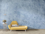 Soft Blue Limewash-Effect Wall Mural – room with a yellow chaise longue mock-up