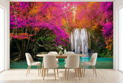 Pink forest waterfall wall mural behind an oak table and cream chairs in a dining room mockup