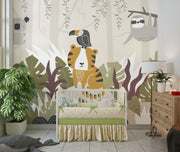Children's room with a crib, sloth wall mural, and wooden dresser.