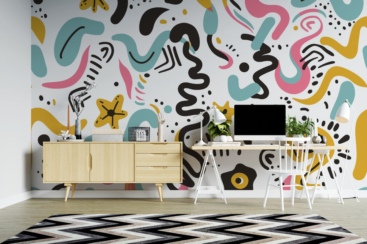 A colorful abstract wavy patterned wallpaper displayed on a wall in a modern home office setting, featuring a light wood sideboard, a white desk with a computer, and a black and white chevron rug.
