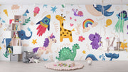 Children's room with colorful wall mural featuring animals and objects.