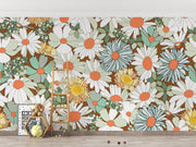 Wallpaper with colorful floral pattern on a wall with a ladder and decor items.