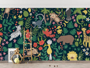 Wallpaper with jungle animals and plants on a dark blue background, with toys and decor items below.