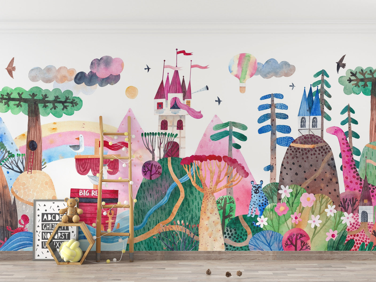 Colorful children's wall mural with castle, trees, and animals on a plain wall.