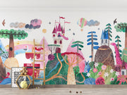 Colorful children's wall mural with castle, trees, and animals on a plain wall.