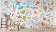 Colorful children's wall mural with various illustrations in a room.
