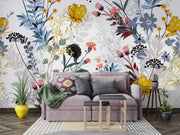 Living room with a gray sofa, decorative pillows, and a colorful floral wall mural.