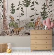 A charming woodland wall mural featuring a deer, fox, owl, and lush greenery surrounded by tall trees. Perfect for kid's rooms or nature-themed nurseries.