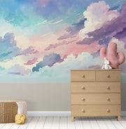 Watercolor cloud wall mural in soft pastel hues of pink, blue, and lavender, creating a dreamy sky effect for kids' rooms and nurseries.