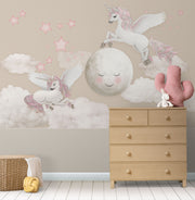 Whimsical Unicorn and Moon Wall Mural with flying unicorns, a smiling moon, pink stars, and fluffy clouds. Perfect fantasy decor for children's rooms.
