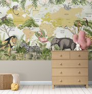 Children's world map wall mural with illustrated safari animals and tropical plants, styled in modern nursery setting.