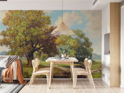Hand-painted style wall mural featuring golden trees, a countryside meadow, and a walking path under a soft sky.