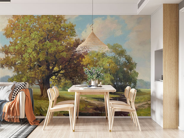Hand-painted style wall mural featuring golden trees, a countryside meadow, and a walking path under a soft sky.