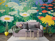 Gray sofa with decorative pillows in a room with a vibrant floral wall mural.