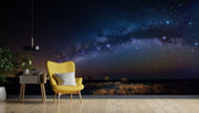 Milky Way Night Sky Wall Mural – Stunning Galaxy Wallpaper Featuring a Starry Sky, Deep Cosmic Blues, and Twilight Horizon for Celestial-Inspired Interiors.