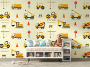 Excavators and dumpers wall mural featuring yellow trucks, cranes, diggers, and traffic cones on a light background, perfect for a boy's bedroom.