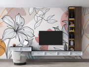 Modern living room with a TV console against a floral wall mural.
