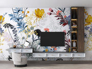 Modern living room with a TV unit against a floral wallpapered wall.